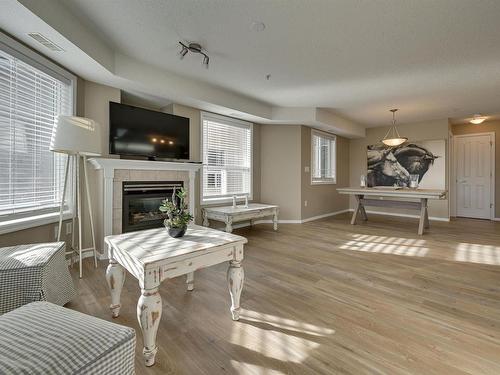 312 9008 99 Avenue, Edmonton, AB - Indoor Photo Showing Living Room With Fireplace