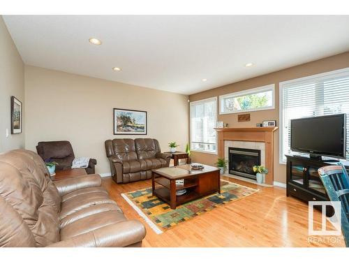 6 Woods Court, Leduc, AB - Indoor Photo Showing Living Room With Fireplace