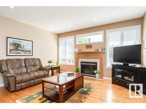 6 Woods Court, Leduc, AB - Indoor Photo Showing Living Room With Fireplace