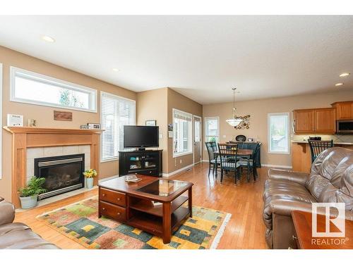 6 Woods Court, Leduc, AB - Indoor Photo Showing Living Room With Fireplace