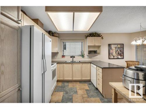 148 Oeming Road, Edmonton, AB - Indoor Photo Showing Kitchen With Double Sink