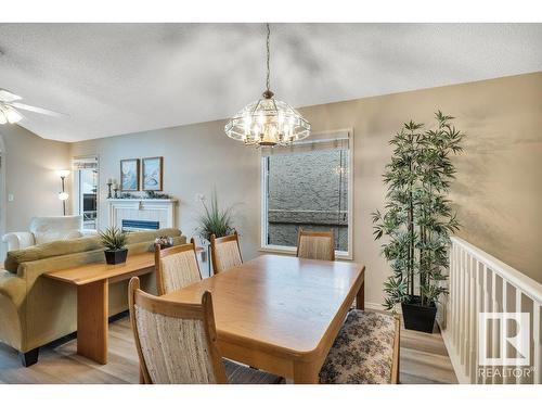 148 Oeming Road, Edmonton, AB - Indoor Photo Showing Dining Room With Fireplace