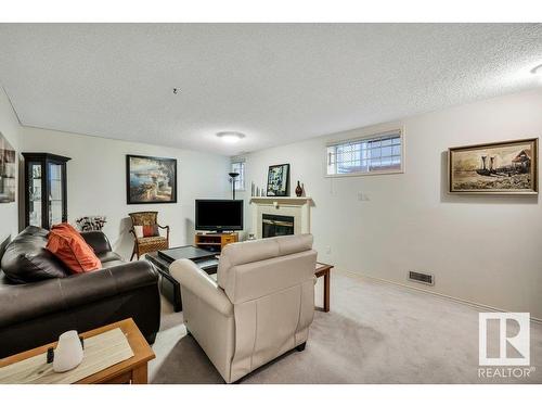 148 Oeming Road, Edmonton, AB - Indoor Photo Showing Living Room With Fireplace