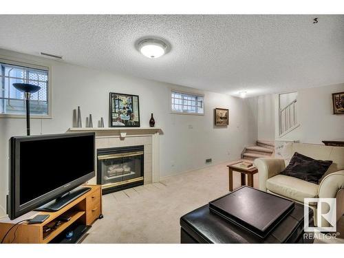 148 Oeming Road, Edmonton, AB - Indoor Photo Showing Living Room With Fireplace