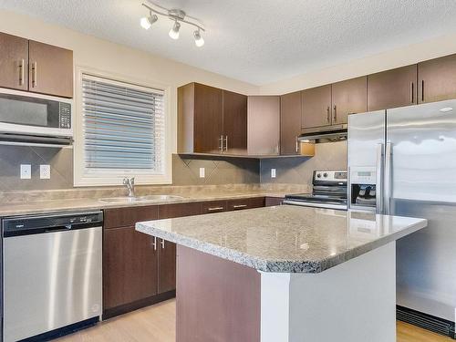 91 Keystone Crescent, Leduc, AB - Indoor Photo Showing Kitchen With Stainless Steel Kitchen