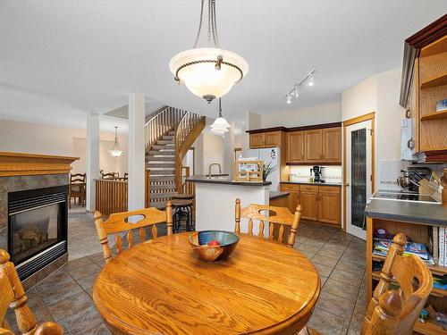 67 53302 Rge Road 261, Rural Parkland County, AB - Indoor Photo Showing Dining Room With Fireplace