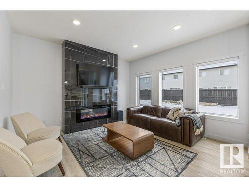 20714 99A Avenue, Edmonton, AB - Indoor Photo Showing Living Room With Fireplace