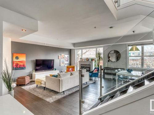 103 10728 82 Avenue, Edmonton, AB - Indoor Photo Showing Living Room With Fireplace