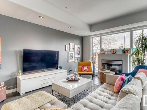 103 10728 82 Avenue, Edmonton, AB - Indoor Photo Showing Living Room With Fireplace