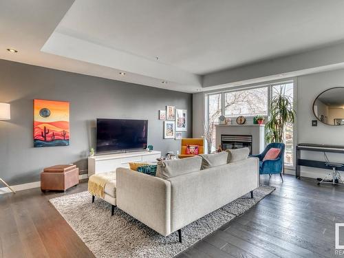 103 10728 82 Avenue, Edmonton, AB - Indoor Photo Showing Living Room With Fireplace