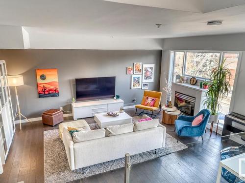 103 10728 82 Avenue, Edmonton, AB - Indoor Photo Showing Living Room With Fireplace