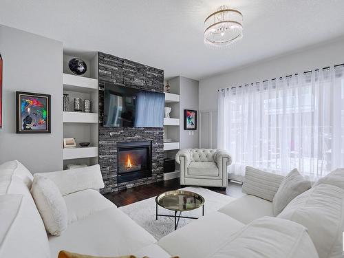 3366 Chickadee Drive, Edmonton, AB - Indoor Photo Showing Living Room With Fireplace