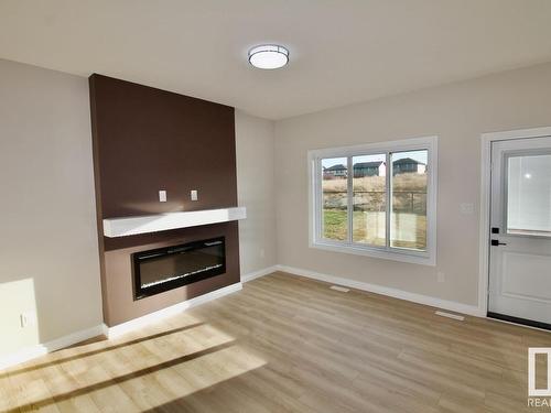 Upper 8835 Carson Way, Edmonton, AB - Indoor Photo Showing Living Room With Fireplace