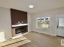 Upper 8835 Carson Way, Edmonton, AB  - Indoor Photo Showing Living Room With Fireplace 