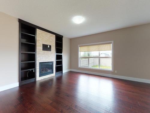 4160 Charles Link, Edmonton, AB - Indoor Photo Showing Living Room With Fireplace