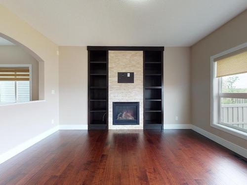 4160 Charles Link, Edmonton, AB - Indoor Photo Showing Living Room With Fireplace