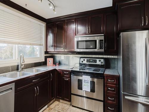 12812 47 Street, Edmonton, AB - Indoor Photo Showing Kitchen With Stainless Steel Kitchen With Double Sink