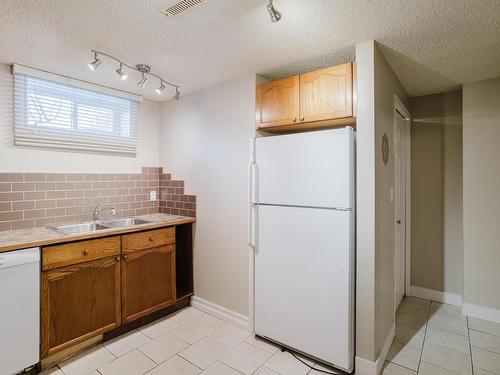 12812 47 Street, Edmonton, AB - Indoor Photo Showing Kitchen With Double Sink