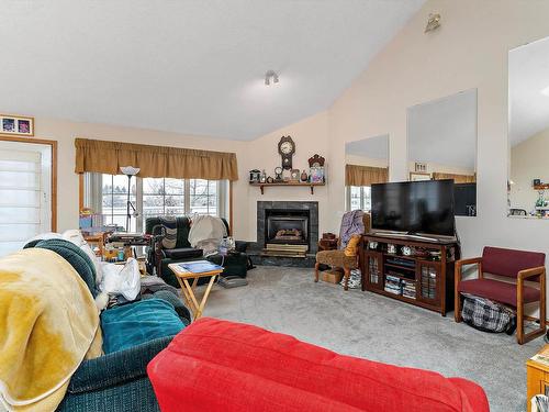 12 J Brown Place, Leduc, AB - Indoor Photo Showing Living Room With Fireplace