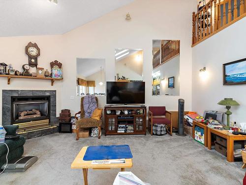 12 J Brown Place, Leduc, AB - Indoor Photo Showing Living Room With Fireplace