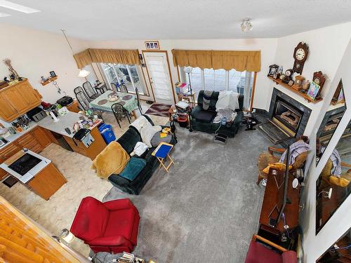 12 J Brown Place, Leduc, AB - Indoor Photo Showing Living Room With Fireplace