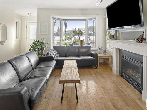 7326 111 Avenue, Edmonton, AB - Indoor Photo Showing Living Room With Fireplace