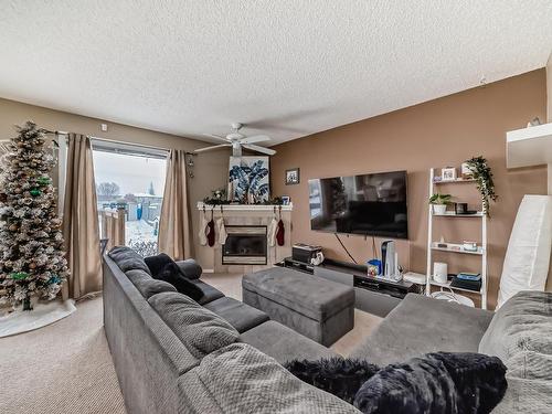 2815 30 Street Nw, Edmonton, AB - Indoor Photo Showing Living Room With Fireplace