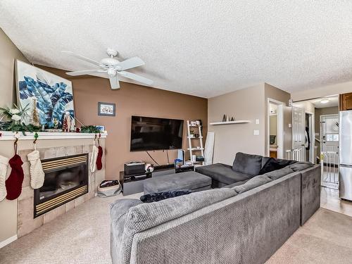 2815 30 Street Nw, Edmonton, AB - Indoor Photo Showing Living Room With Fireplace