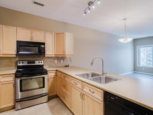 239 160 Magrath Road, Edmonton, AB - Indoor Photo Showing Kitchen With Double Sink