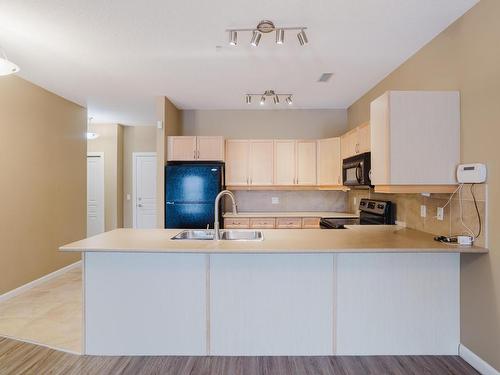 239 160 Magrath Road, Edmonton, AB - Indoor Photo Showing Kitchen With Double Sink