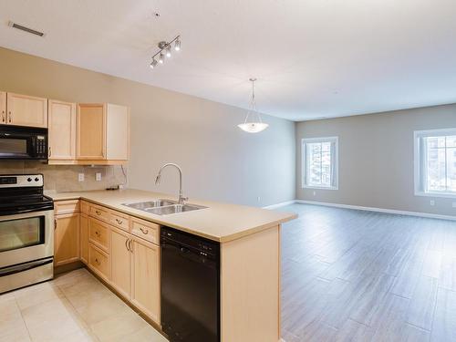 239 160 Magrath Road, Edmonton, AB - Indoor Photo Showing Kitchen With Double Sink