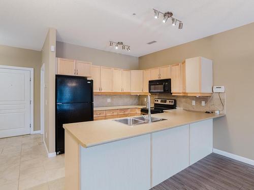 239 160 Magrath Road, Edmonton, AB - Indoor Photo Showing Kitchen With Double Sink