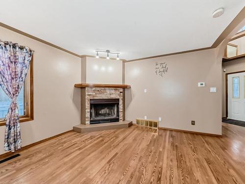 7008 157 Avenue, Edmonton, AB - Indoor Photo Showing Living Room With Fireplace