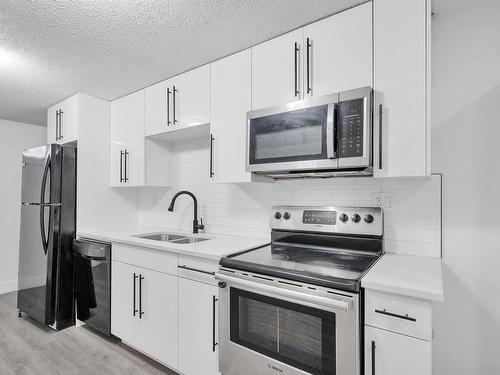 14216 58 Street, Edmonton, AB - Indoor Photo Showing Kitchen With Double Sink