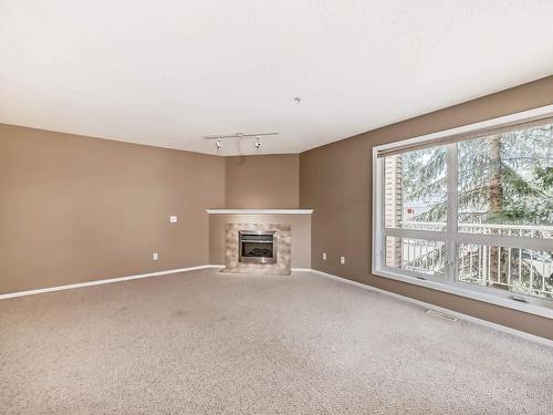 202 10528 77 Avenue, Edmonton, AB - Indoor With Fireplace