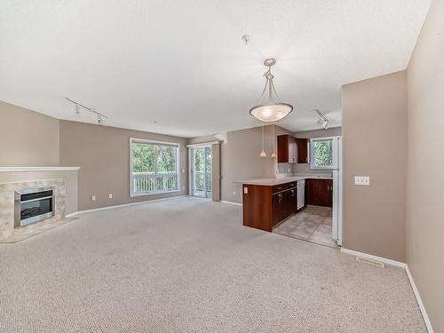 202 10528 77 Avenue, Edmonton, AB - Indoor With Fireplace