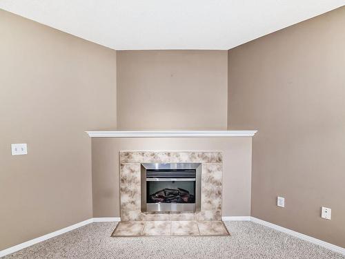 202 10528 77 Avenue, Edmonton, AB - Indoor Photo Showing Living Room With Fireplace