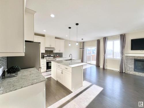 16607 18 Avenue, Edmonton, AB - Indoor Photo Showing Kitchen With Fireplace