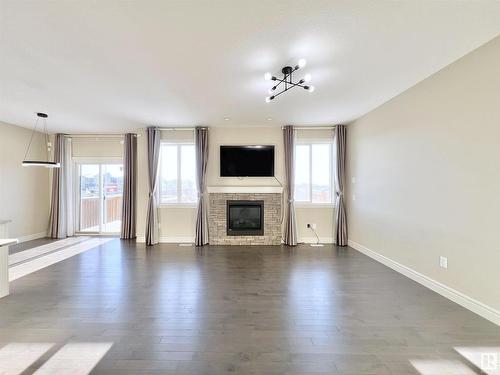 16607 18 Avenue, Edmonton, AB - Indoor Photo Showing Living Room With Fireplace