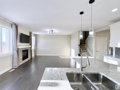 16607 18 Avenue, Edmonton, AB - Indoor Photo Showing Kitchen With Fireplace With Double Sink