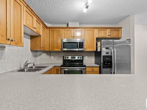 230 1520 Hammond Gate Gate, Edmonton, AB - Indoor Photo Showing Kitchen With Double Sink