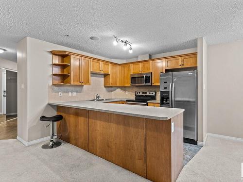 230 1520 Hammond Gate Gate, Edmonton, AB - Indoor Photo Showing Kitchen With Double Sink