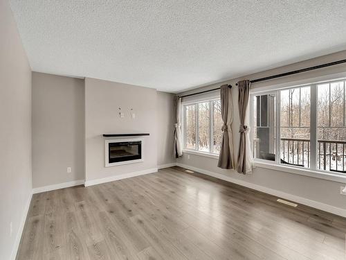 26 1005 Graydon Hill Boulevard, Edmonton, AB - Indoor Photo Showing Living Room With Fireplace