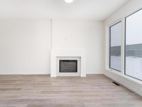 7333 Klapstein Crescent, Edmonton, AB - Indoor Photo Showing Living Room With Fireplace