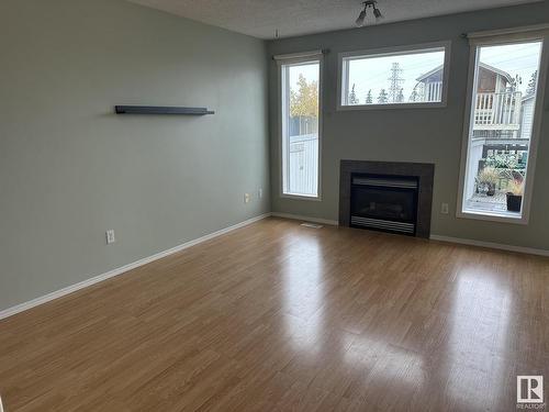 7932 2 Avenue, Edmonton, AB - Indoor Photo Showing Living Room With Fireplace