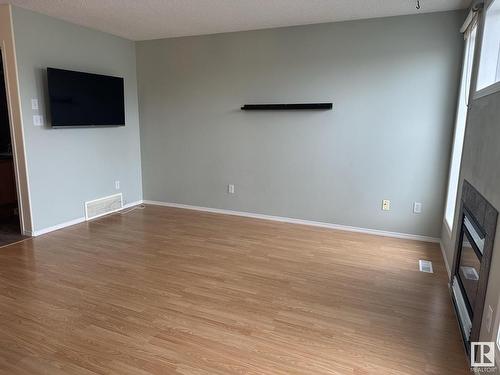 7932 2 Avenue, Edmonton, AB - Indoor Photo Showing Other Room With Fireplace