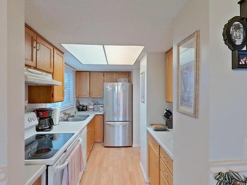 13861 24 Street, Edmonton, AB - Indoor Photo Showing Kitchen With Double Sink