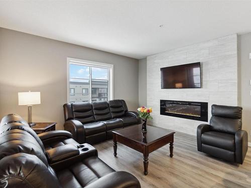 423 1154 Adamson Drive, Edmonton, AB - Indoor Photo Showing Living Room With Fireplace