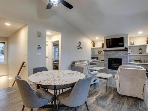 54 53004 Range Road 54A, Rural Parkland County, AB - Indoor Photo Showing Dining Room With Fireplace