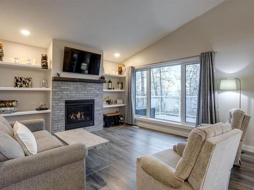 54 53004 Range Road 54A, Rural Parkland County, AB - Indoor Photo Showing Living Room With Fireplace